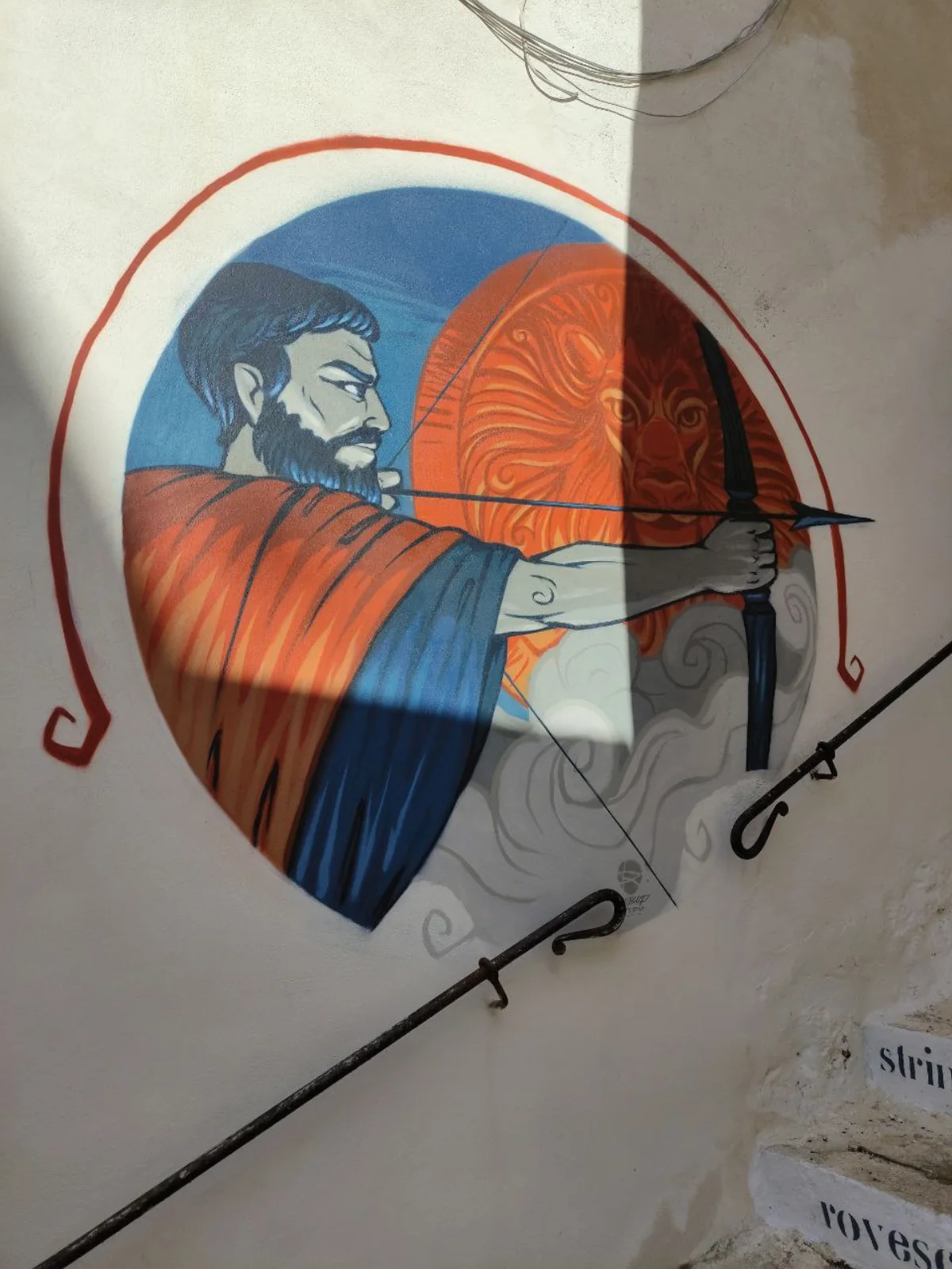 Il murale di Ulisse che tende l'arco